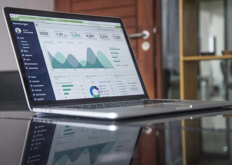 Laptop showing website traffic growth charts – how long does SEO take to show results