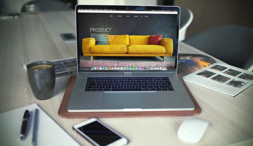 Laptop on a work desk for comparing WordPress vs Shopify India website platforms for small business